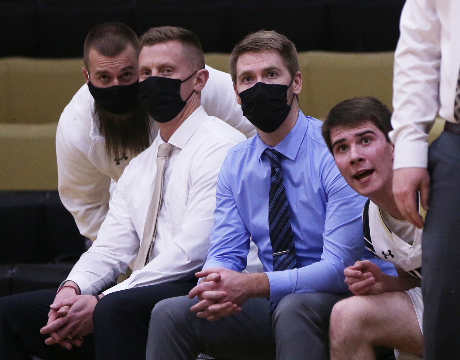 Ryan Mader leans down to talk with assistant coach Aaron Mines